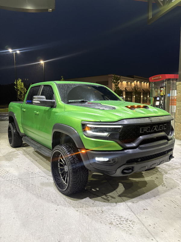 Ram TRX wrapped in gloss green, photographed at night